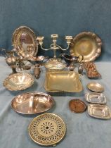 Miscellaneous silver plate including cake baskets, bowls, sauce boats, a candelabra, salt & pepper