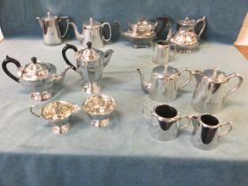 A collection of silver plated tea and coffee wares including two four-piece sets, three teapots, a