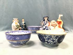 Miscellaneous oriental ceramics including figurines, three blue & white bowls, a saki bottle -