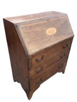 An Edwardian mahogany bureau, the slant front with satinwood banding and shell inlay opening to