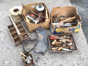 Miscellaneous tools including hammers, screwdrivers, a roll of sash cord, pliers, secateurs, an