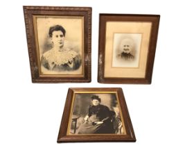 Three nineteenth century sepia photographs of Victorian ladies, all in oak frames with gilt