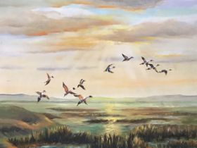 J Saunders-Davies, oil on board, ducks rising at sunset over marshland, signed and framed. (21.5in x