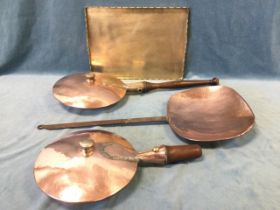 Two Victorian copper bed warming pans with short hardwood handles, the circular reservoirs with