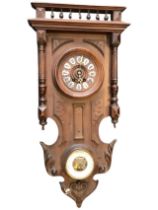 A C19th French walnut clock and barometer, the galleried cornice above a turned dial with roman