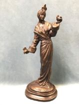 C20th bronze, cast of an eastern robed lady holding doves, probably Japanese, mounted on rectangular