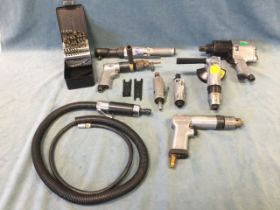 A quantity of pneumatic air tools - an anglegrinder, a wrench, die grinders, an impact drill, an air