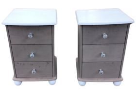 A pair of painted pine beside chests, the rectangular tops above three drawers mounted with cut