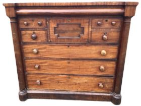 A Victorian mahogany scotch chest of drawers, the top above a long frieze drawer and six further