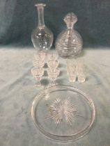 A ribbed cut glass decanter & stopper; a circular cut glass tray; two sets of six cut glass