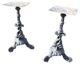A pair of Victorian cast iron table supports, fluted columns cast with dolphins, on scrolled