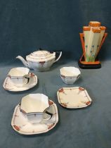 A 1920s Shelley tea-for-two set decorated in the red daisy pattern - painted no 11497; and a