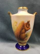 A handpainted tapering Aynsley vase with burnished gilt handles, decorated with a squirrel and