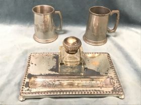 A plated desk tidy with heavy glass inkwell fitted in tray with pen well framed by beaded borders