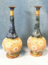 A pair of Royal Doulton stoneware vases with slender tapering trumpet necks above bun-shaped