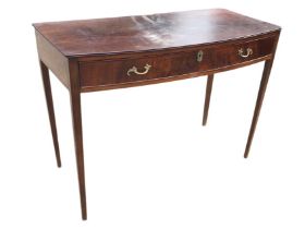 A Georgian style bowfronted mahogany serving table, the frieze drawer with moulded brass handles and