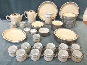 A Denby stoneware dinner service - cups, saucers, side plates, dinner plates, soup bowls, serving