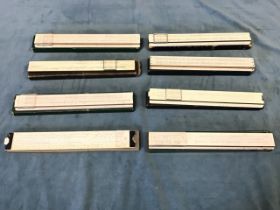 A collection of boxed slide rules, makers including Albert Nestler, Darmstadt, Frith Brown,