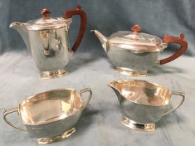 A hallmarked silver four-piece teaset of rectangular rounded form with tapering handles and