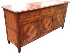 A mahogany sideboard, the moulded top with ebonised stringing above three frieze drawers with