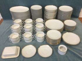 An extensive German porcelain dinner service by Thomas with gilded rims - dinner, side & dessert,