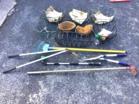 Miscellaneous garden tools and metal flower baskets - a rake, shears, edging lippers, a hoe, a spray