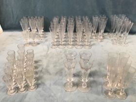 A collection of tapering funnel shaped glasses some 19th century, including faceted tapering bowls