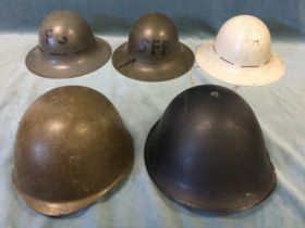 An American M1 steel helmet; a Russian steel helmet; and three WW2 home service metal helmets. (5)