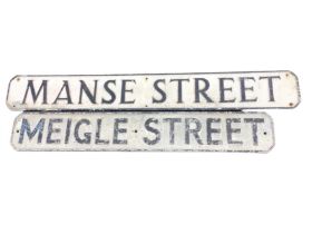 Two cast aluminium street names, the rectangular panels with canted corners and raised lettering -