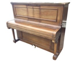 A mahogany cased upright piano by The Piano Workers Guild Ltd of London, the panelled overstrung