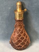 A Victorian copper powder flask by G & JW Hawksley of Sheffield, the body embossed with rope network