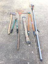 Miscellaneous garden tools - an axe, a set of chimney rods, a rake, a lawn edge trimmer, a long