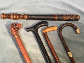 A Victorian tapering truncheon with ribbed handle in original painted finish on ebonised ground, the