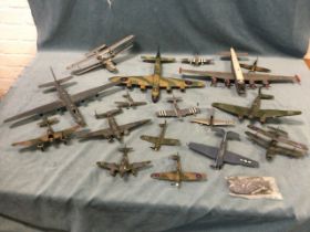 A collection of WWII model aeroplanes including a Lancaster, spitfire, a bi-plane, Messerschmitt,