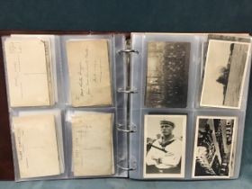 An album containing a collection of World War I & II postcards, some written and some blank,