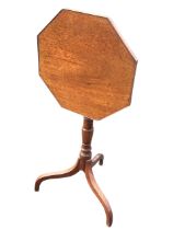 A 19th century mahogany occasional table, the octagonal top tilting on a vase turned column,