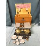 A boxed set of mid-century Weylux Guardian baby weighing scales, the midwifes box complete with