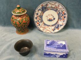 A C19th Japanese Imari plate painted with panels of lotus, prunus and peony; a Chinese baluster vase