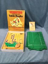 A boxed set of Subbuteo rugby, a 1970s international edition with cloth field, players, scrummer,