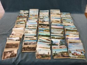 A collection of postcards including landscapes, coastal, architecture, greetings, sentimental, world