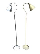 A chrome reading lamp with adjustable shade on column above a circular weighted base; and another