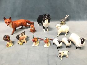 A collection of Beswick birds & animals - fox, pheasants, sheep & lambs, a sheepdog, three birds,