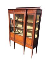 An Edwardian mahogany breakfront display cabinet, the moulded back above a satinwood crossbanded