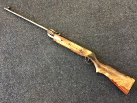 An old .22 air rifle with adjustable sights and scorched stock. (42.25in)