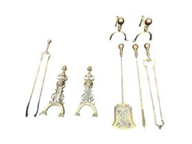 A set of Victorian brass fire irons - poker, tongs & shovel with matching firedogs with ball