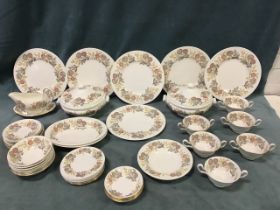 A Wedgwood dinner service decorated in the Lichfield pattern with tureens & covers, dinner, side and