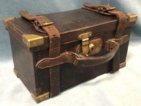 A leather cartridge case by Charles Lancaster & Co Ltd, with brass reinforced corners and lock,