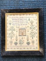 A William IV sampler dated 1837, finely sewn by Martha Spittle aged 10 with vases of flowers framing