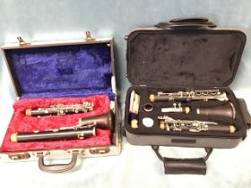 A cased Montreux clarinet with cleaning equipment and spare reeds; and an English cased rosewood