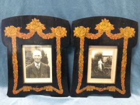 A pair of Edwardian ebonised arts and crafts penwork photograph frames decorated with rose and